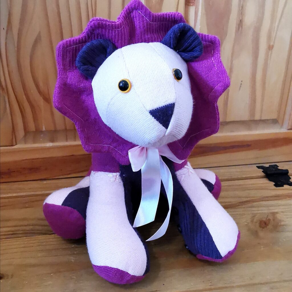 A purple lion keepsake animal