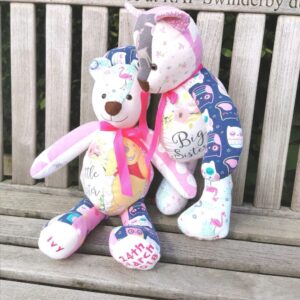 Two memory bears on a bench