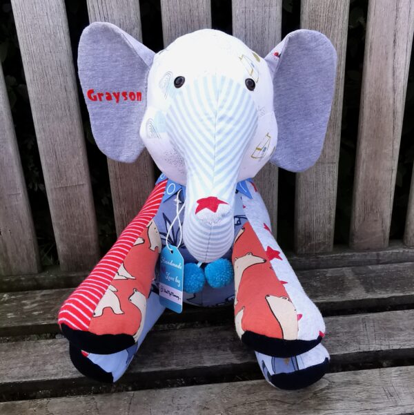 A custom memory elephant sat on a bench