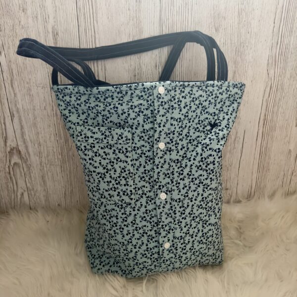 A green memory tote bag created from a dress