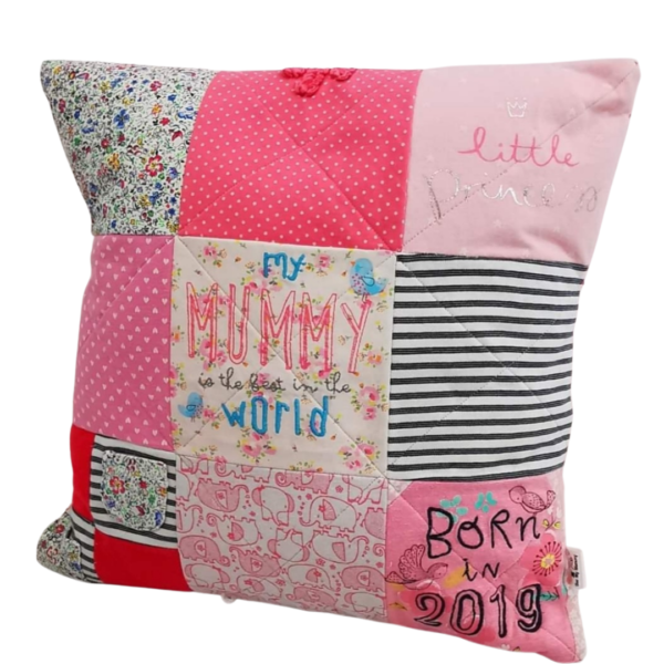 A pink patchwork memory cushion