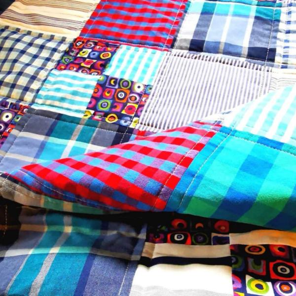 Various fabrics sewn together into a blanket