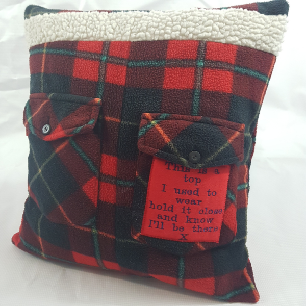 Red memory cushion made from the clothing of a loved one