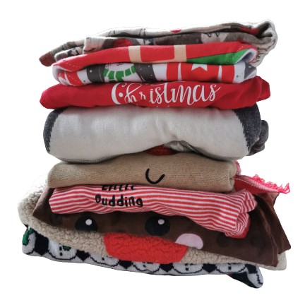 A pile of Christmas themed clothes