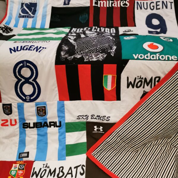 A patchwork memory quilt made with mostly football shirts