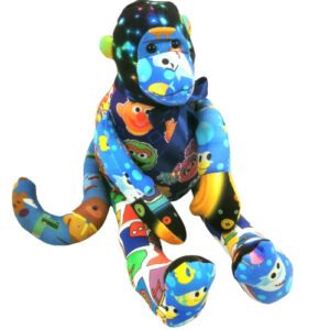 A keepsake memory monkey made with a variety of busy fabrics