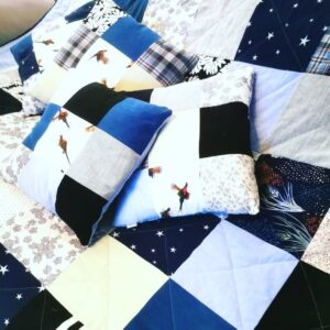 Kingsize quilt with blue and white squares