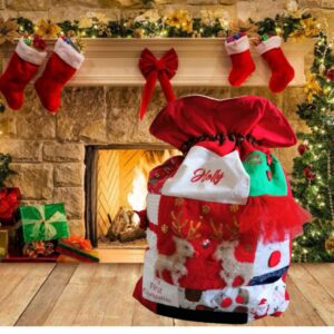 A custom Christmas sack in front of a lit fireplace