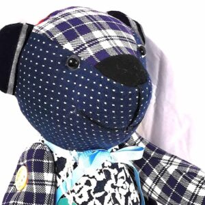 traditional button jointed remembrance bear with movable arms and legs