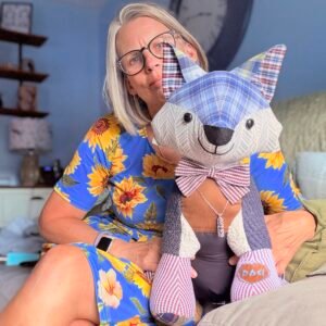 authentic memory keepsake maker holding a completed custom memory fox